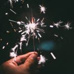 Image of a hand holding a sparkler to celebrate the best of the 2016 Signius blog