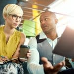 Image of two people successfully marketing a small business