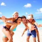 Image of a family enjoying summer vacation on a beach
