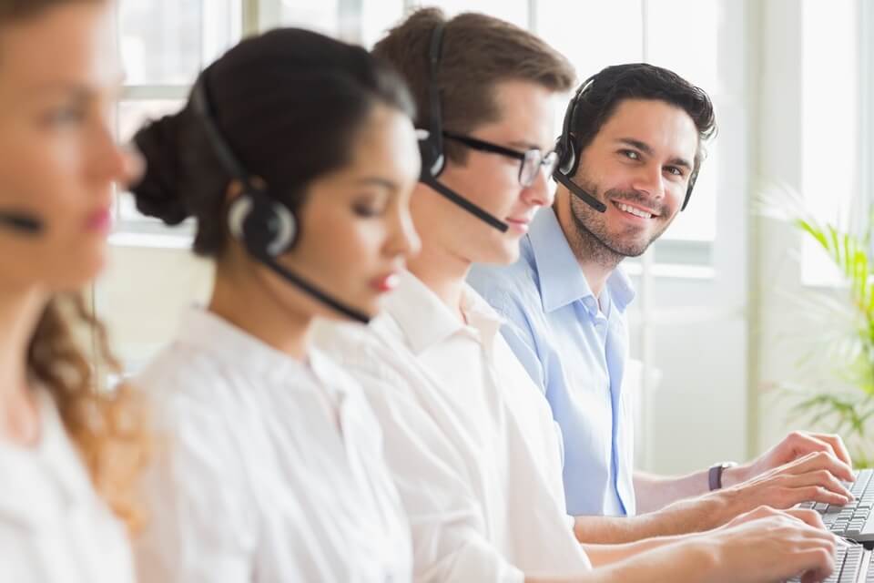 Image of four Signius customer care call center agents